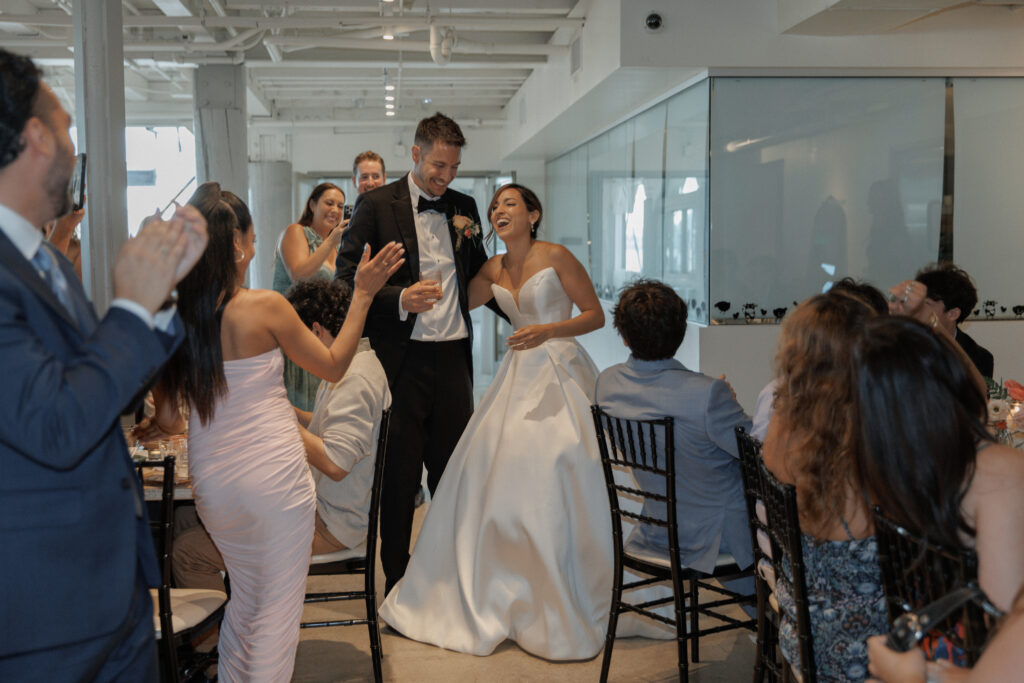 Wedding guests gathered inside Malibu Farm San Diego during AJ and Janel's celebration