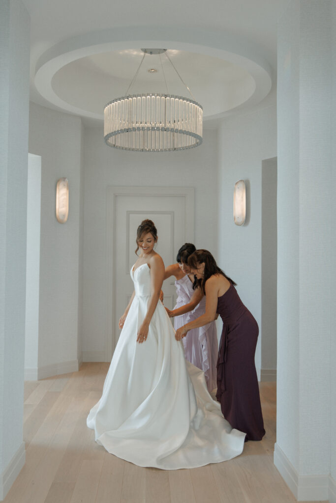 Bride getting ready with her bridal team before the wedding ceremony