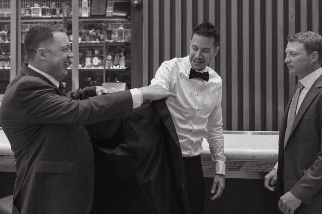 Groom getting ready in his formal wedding attire before the ceremony