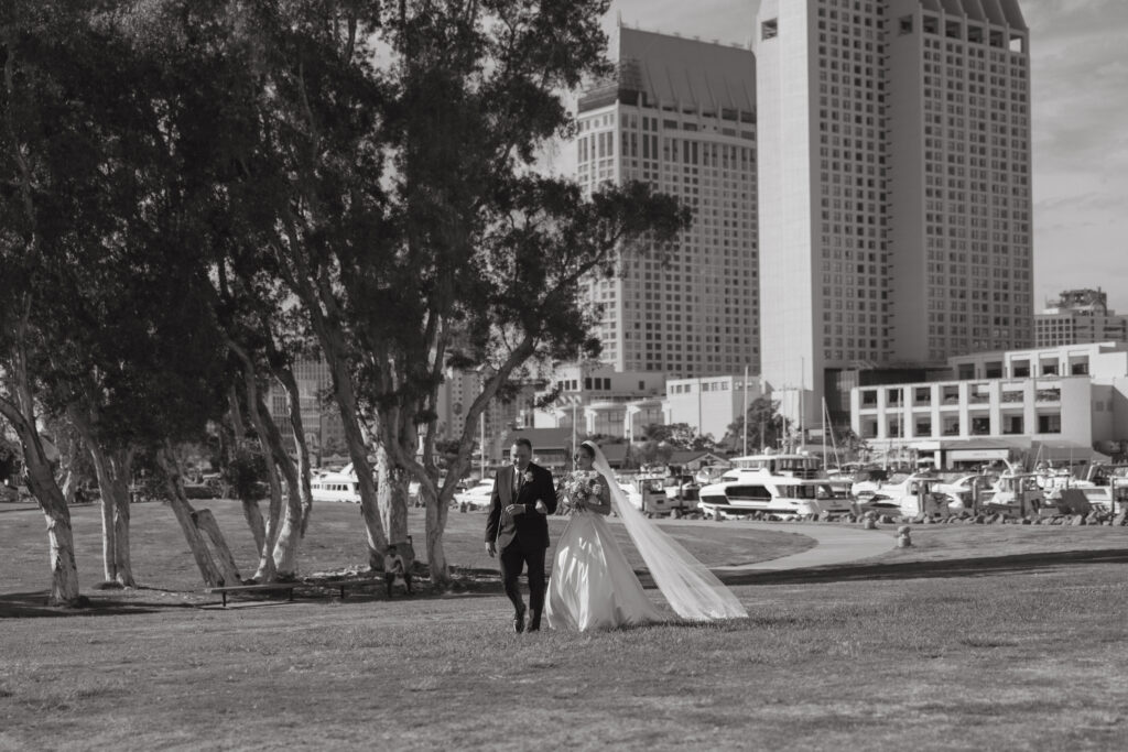 Bride walking toward her wedding ceremony with her father