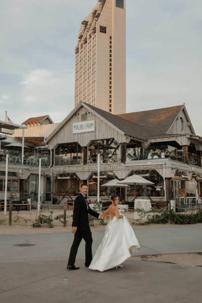 AJ and Janel outside Malibu Farm during their San Diego wedding