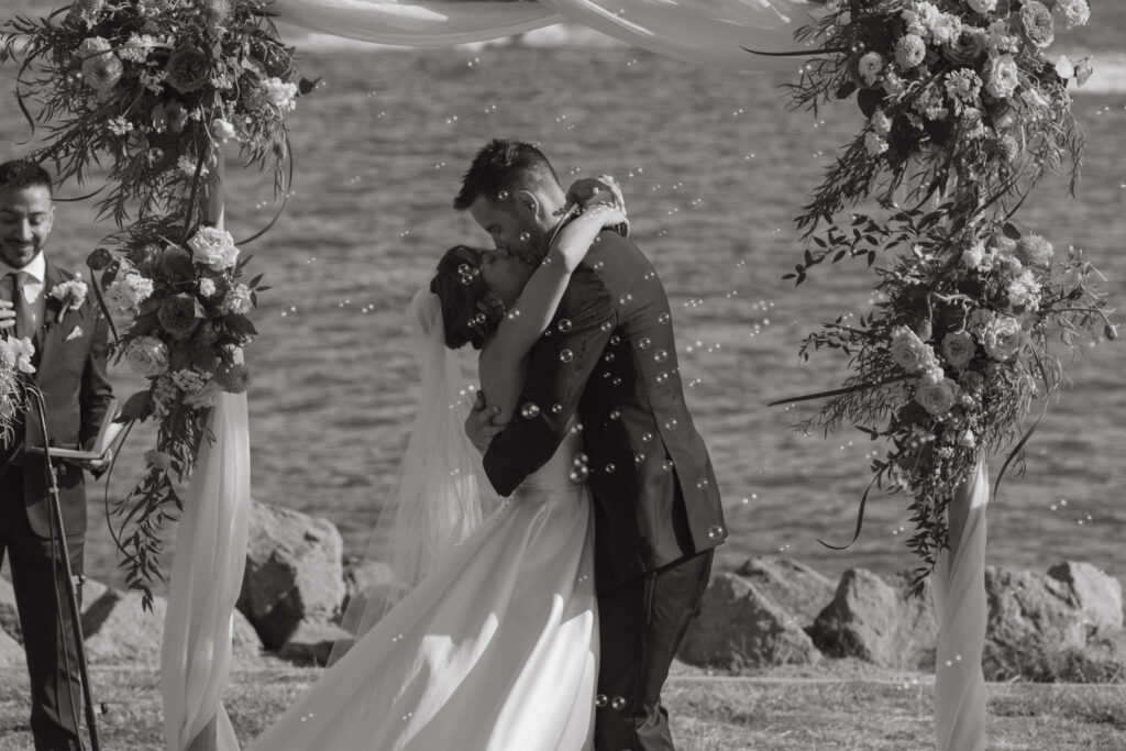 AJ and Janel surrounded by the waterfront during their Malibu Farm wedding